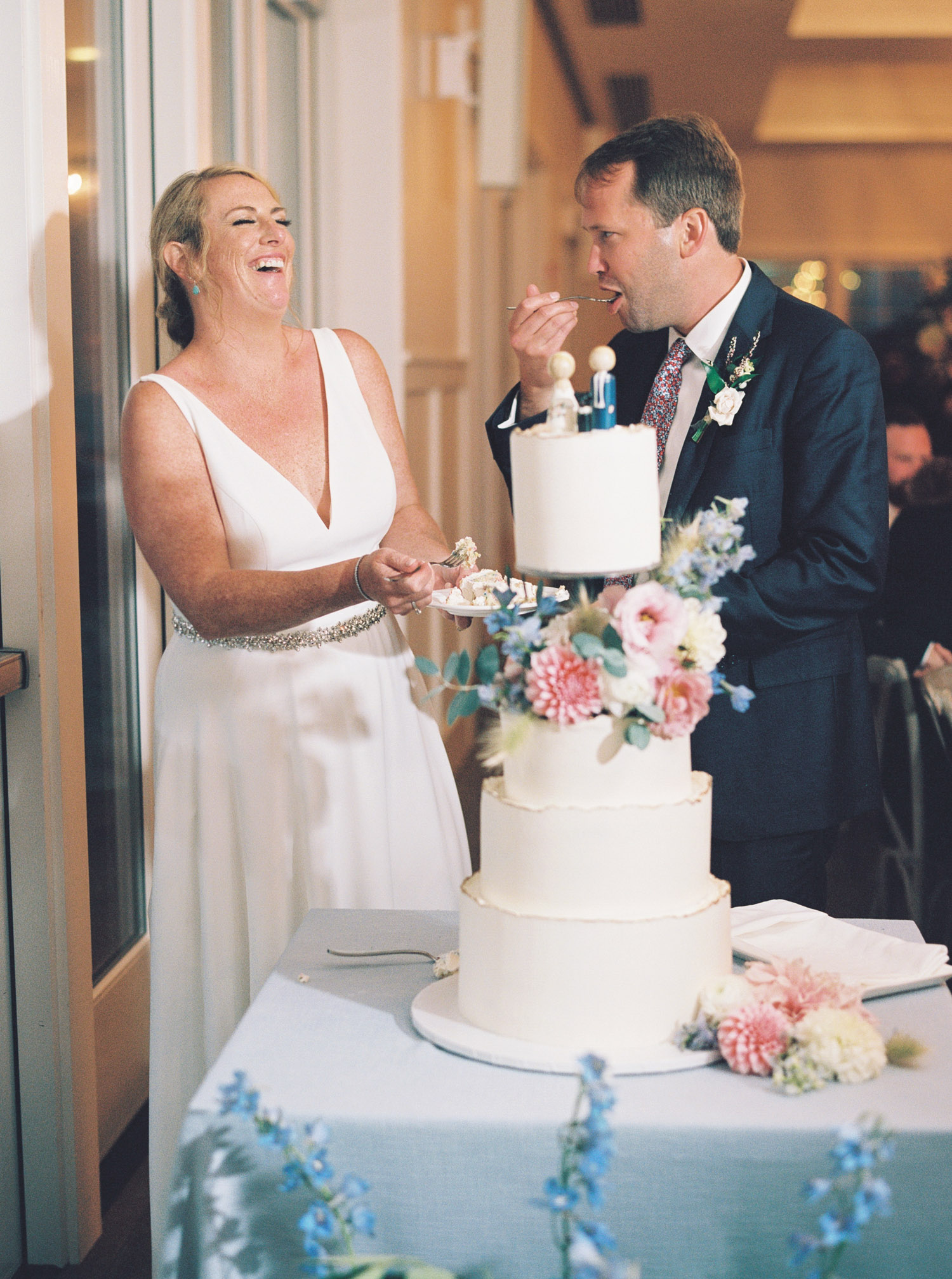bride and groom cake cutting at Pelham House Resort wedding